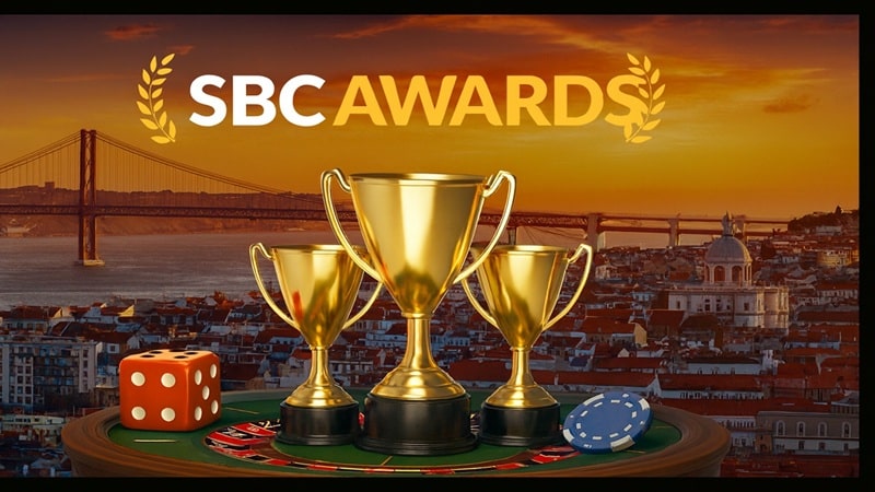 SBC Awards 2025 trophies displayed with casino elements against the Lisbon city skyline at sunset