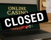 Laptop displaying online casino with CLOSED sign representing Golden Billy Casino shutdown