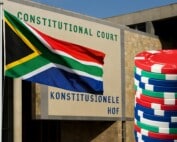 South African Constitutional Court building in Pretoria with national flag and casino chips representing freeplay tax ruling 1280x720 image