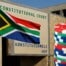 South African Constitutional Court building in Pretoria with national flag and casino chips representing freeplay tax ruling 1280x720 image