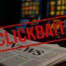 Stack of British newspapers with a red clickbait stamp symbolising exaggerated UK gambling news coverage