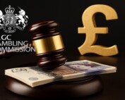 Judge’s gavel and British pound notes symbolizing UK Gambling Commission fines and enforcement in 2025.