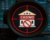 Casino building in crosshair with prohibition symbol representing gambling enforcement crackdown