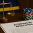 Justice scales and casino chips with Alternative Resolution document representing Curacao Gaming Authority's new ADR regulations for online casino player dispute protection