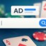 Google search bar with AD label overlaid on casino poker chips and playing cards representing online gambling advertising