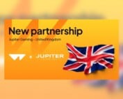 Ankündigung der Partnerschaft zwischen Wazdan und Jupiter Gaming mit Großbritannienflagge.