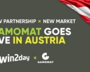 Ankündigung neue Partnerschaft mi Logo von Gamomat und win2day und einer Österreich-Flagge.