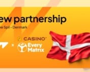 Ankündigung der neuen Partnerschaft zwischen Wazdan und Danske Spil, mit Logos und Dänemark-Flagge.